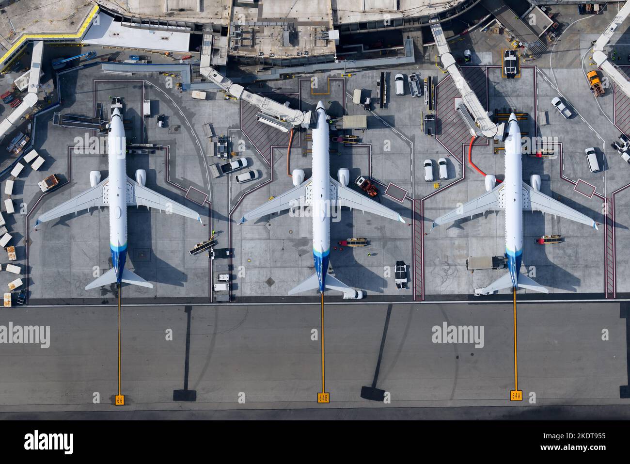 Top down view of Alaska Airlines Boeing 737 aircraft at Los Angeles International Airport Terminal 6. Aerial view of Alaska Airlines 737 airplanes. Stock Photo