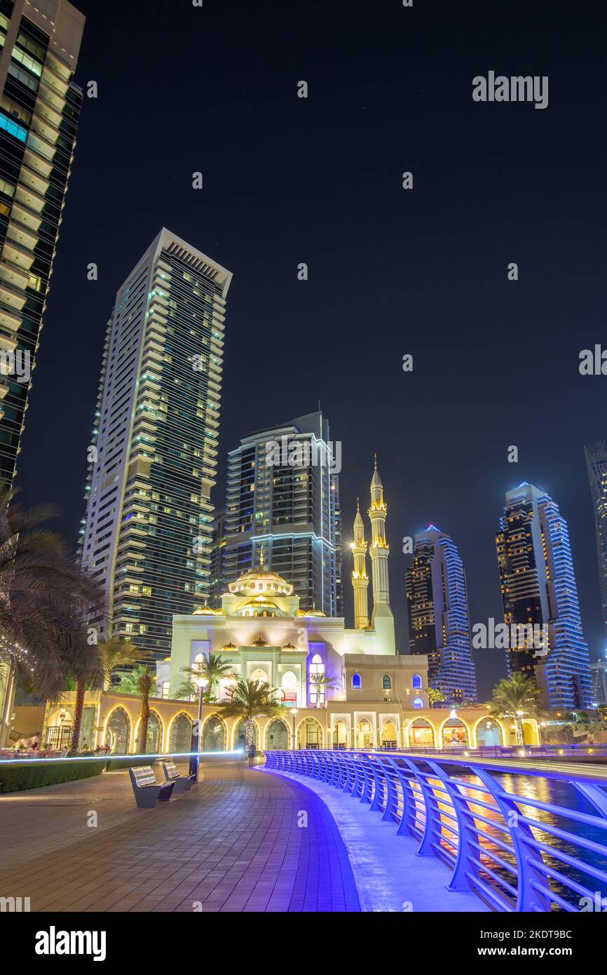 Dubai, United Arab Emirates - May 25, 2021: Mosque At Dubai Marina Skyline Architecture Luxury Vacation In Arabia Portrait At Night In Dubai, United A Stock Photo