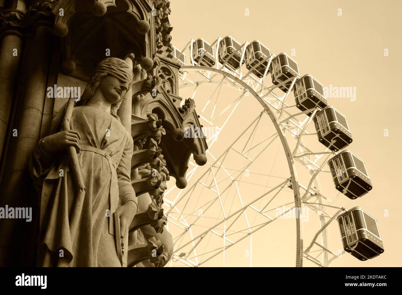 Christmas Ferris wheel in front of the cathedral of Metz. Woman with