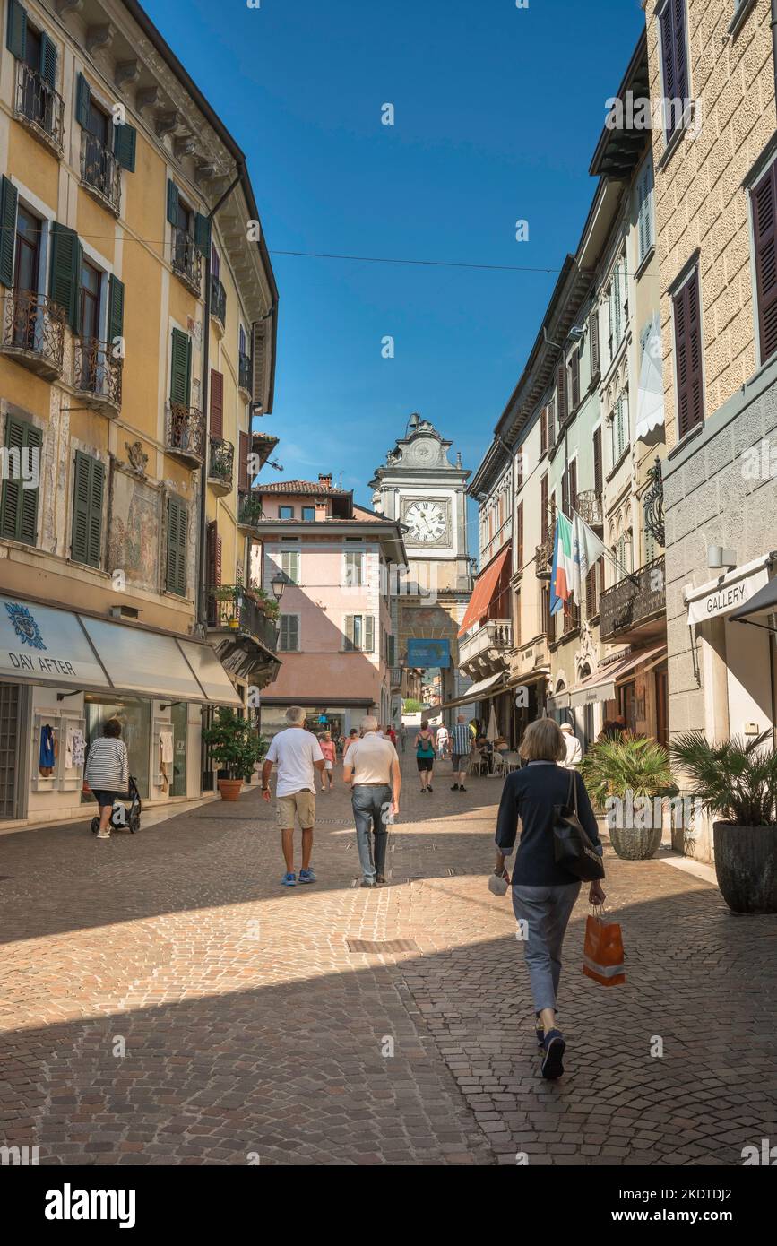 Salo Italy, view in summer of people walking past upmarket shops that line each side of the Via San Carlo in the scenic Lake Garda town of Salo, Italy Stock Photo
