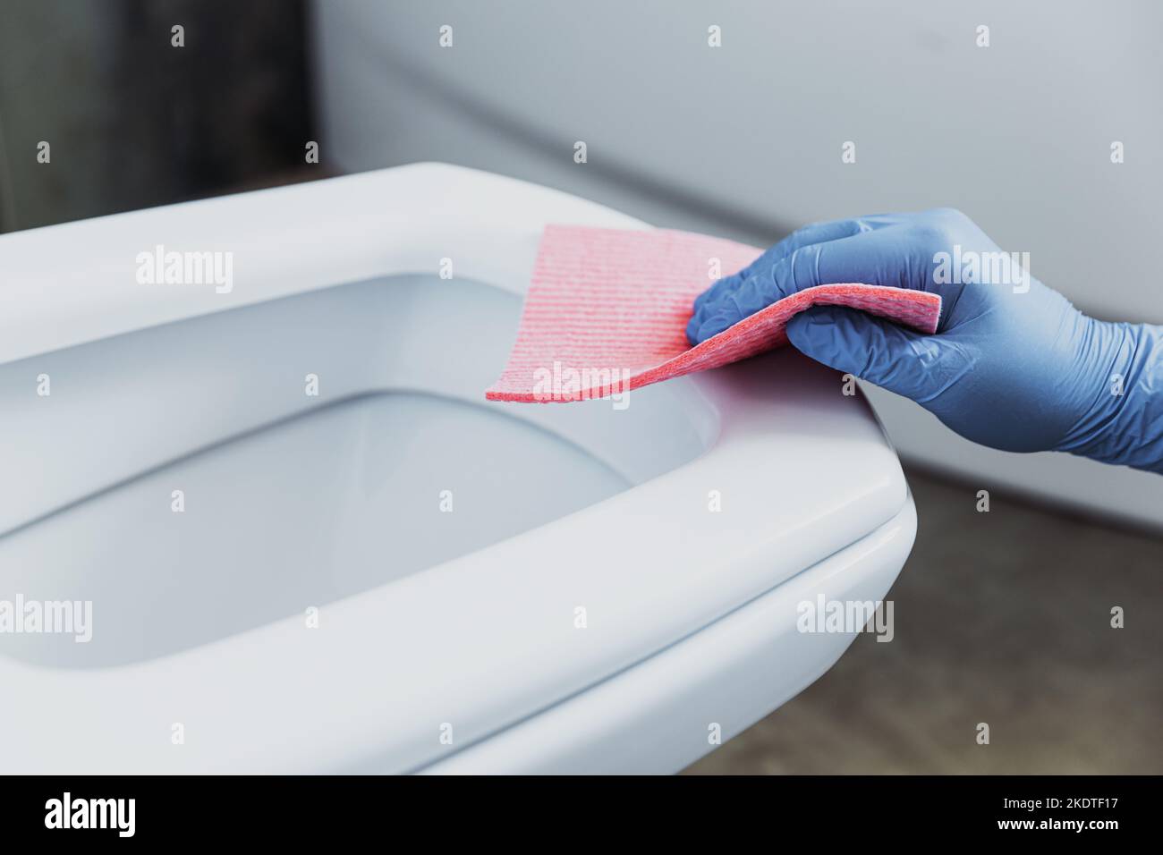 Woman hand closeup gloved in rubber protective gloves. Housewife