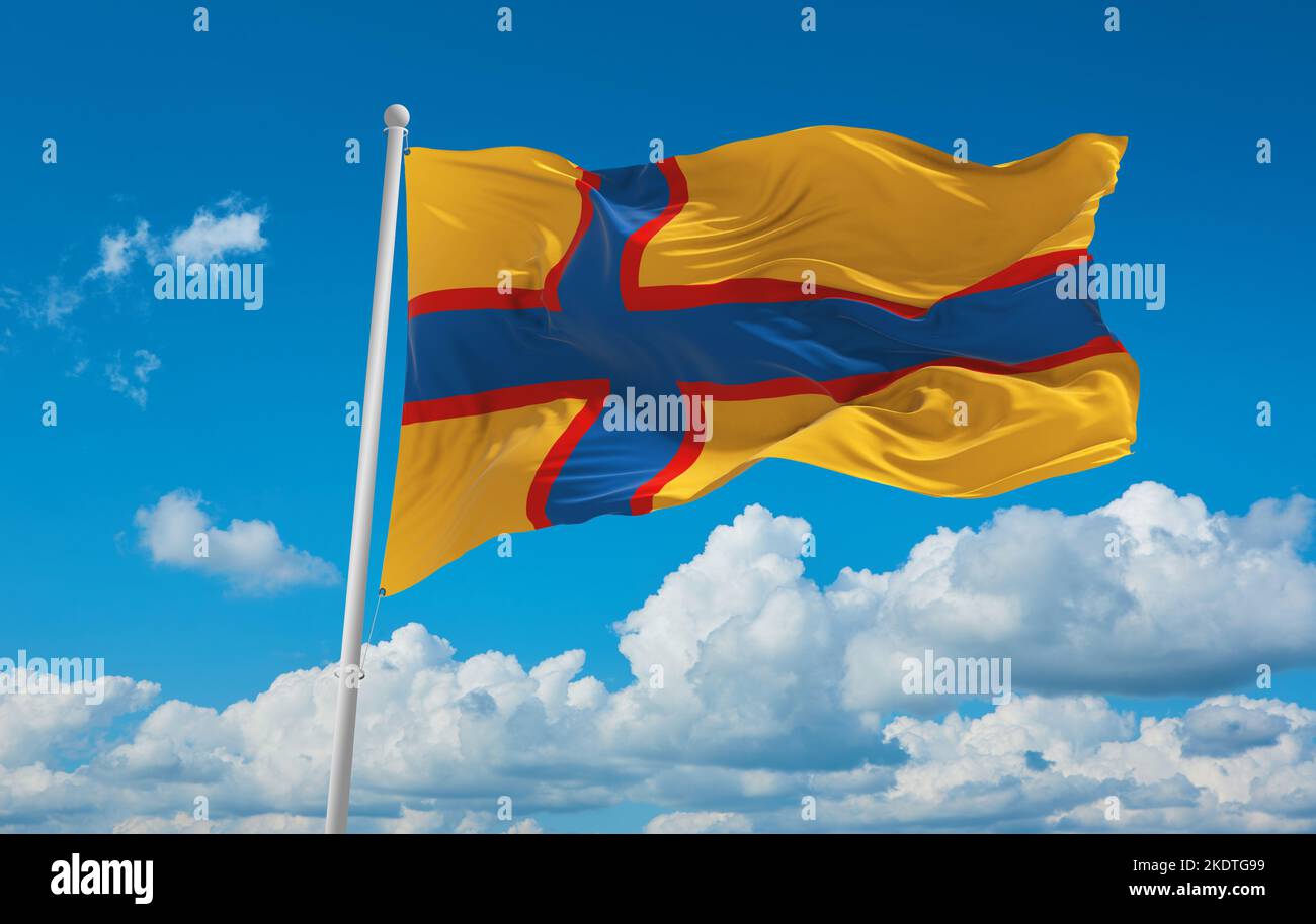flag of Baltic Finns Ingrian Finns at cloudy sky background, panoramic view. flag representing ethnic group or culture, regional authorities. copy spa Stock Photo