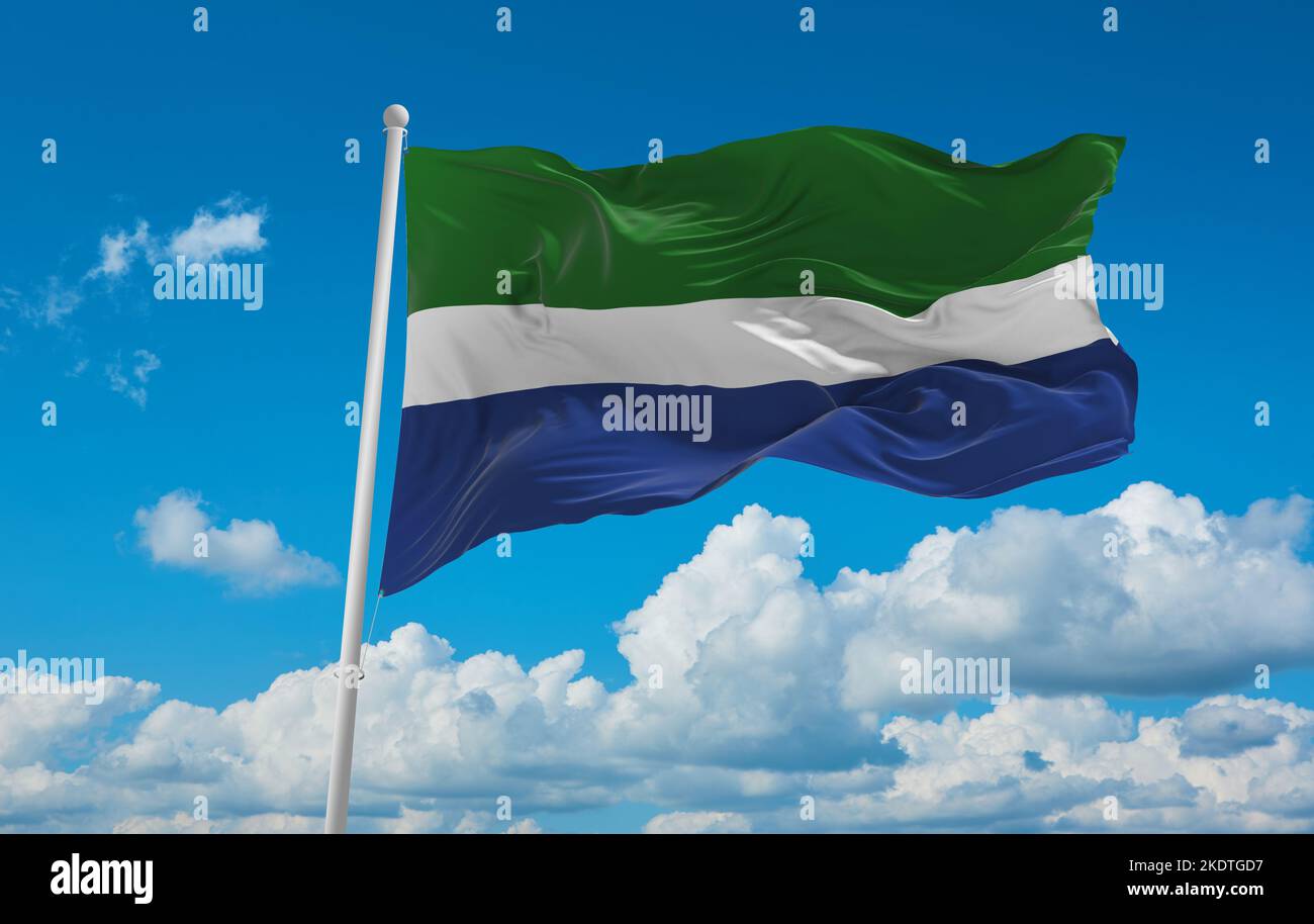 flag of Baltic Finns Livonians at cloudy sky background, panoramic view. flag representing ethnic group or culture, regional authorities. copy space f Stock Photo