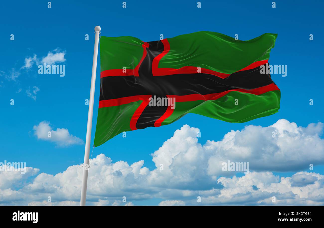 flag of Baltic Finns Karelians at cloudy sky background, panoramic view. flag representing ethnic group or culture, regional authorities. copy space f Stock Photo