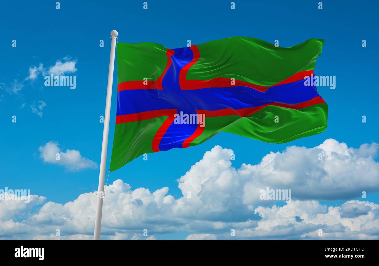 flag of Baltic Finns Ludic Karelians at cloudy sky background, panoramic view. flag representing ethnic group or culture, regional authorities. copy s Stock Photo