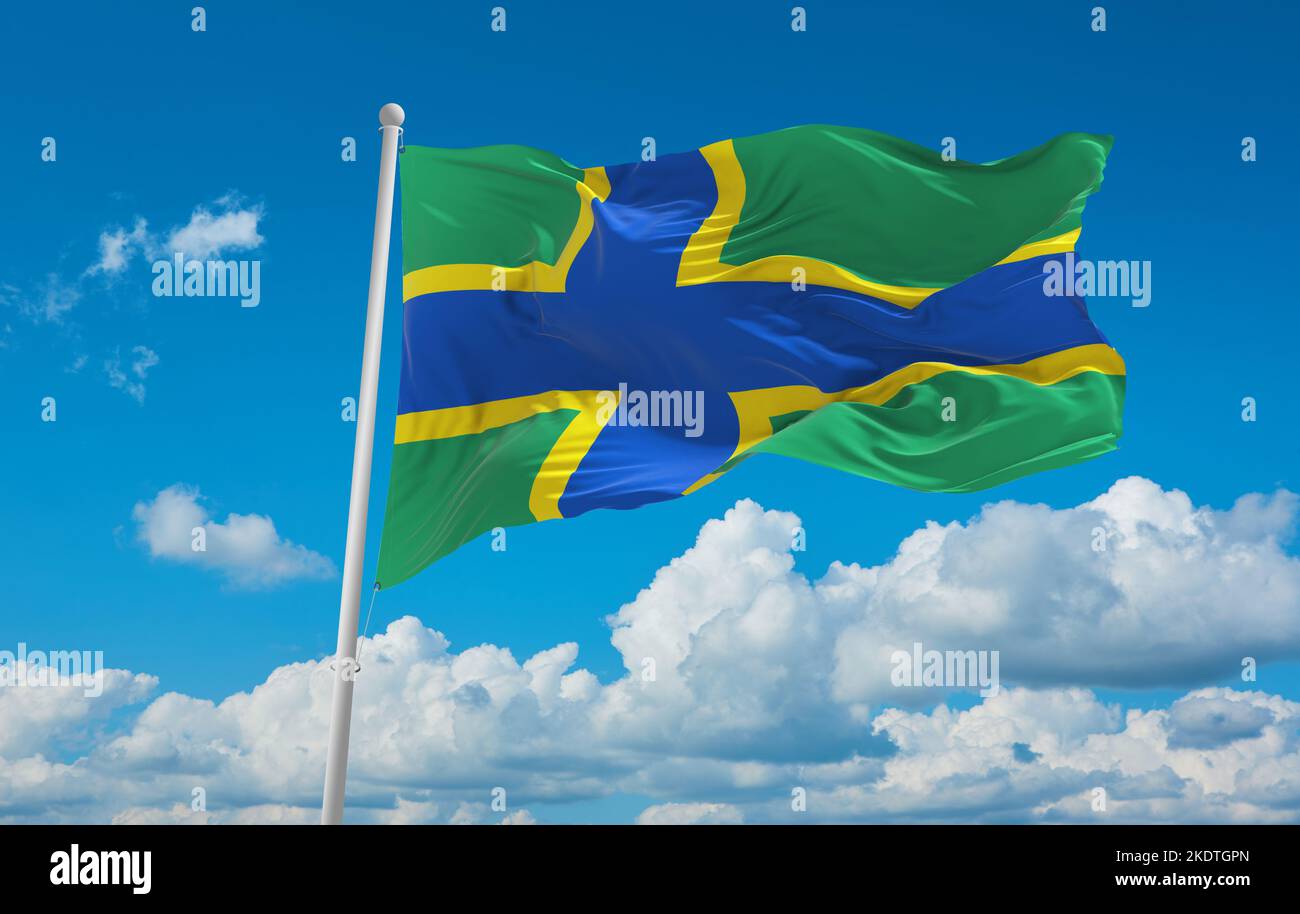 flag of Baltic Finns Vepsians at cloudy sky background, panoramic view. flag representing ethnic group or culture, regional authorities. copy space fo Stock Photo