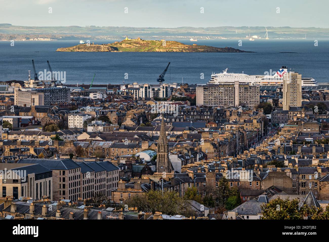 View over rooftops to Leith, Walk Inchkeith island in Firth of Forth & MS Victoria ship, Edinburgh, Scotland, UK Stock Photo