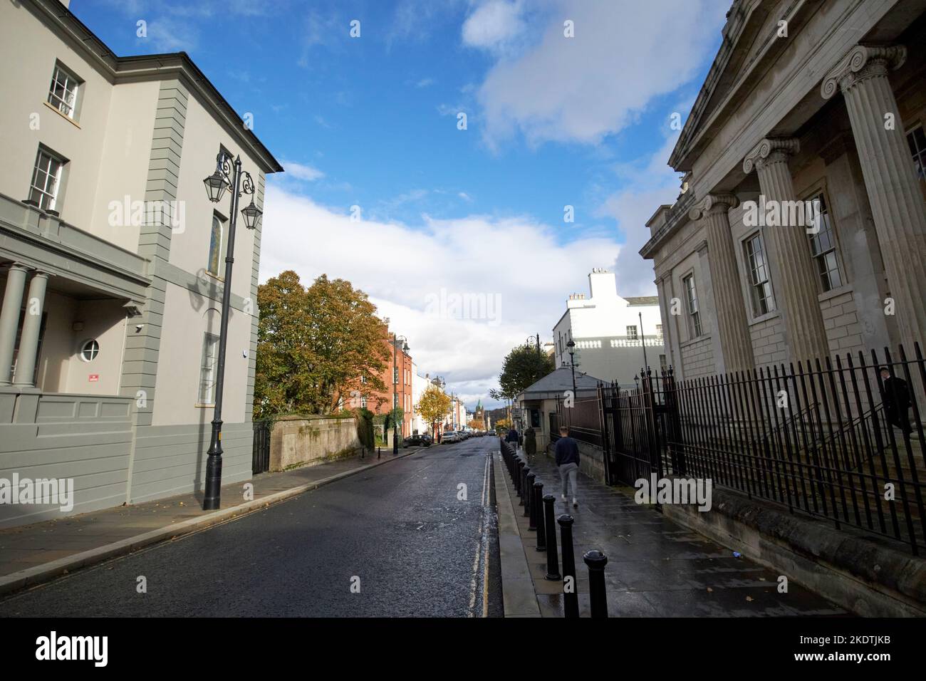 looking down bishop st with bishop street courthouse on the right bishops palace on the left derry londonderry northern ireland uk Stock Photo