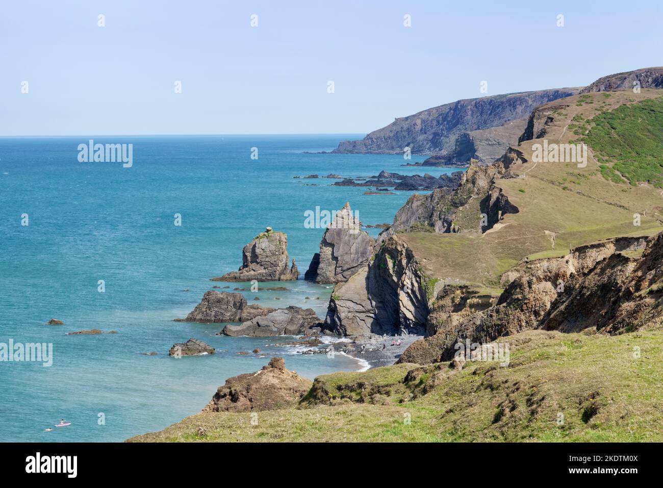 View from the SW coast path of Sandymouth beach and heavily eroded cliffs looking north to Lower Sharpnose Point, near Bude, north Cornwall, UK, July Stock Photo