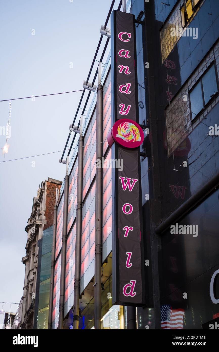 London, UK - November 6, 2022: Candy World shop sign on busy Oxford shopping street. Stock Photo