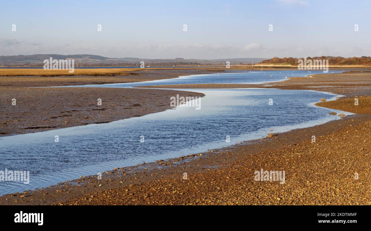Snowhill creek at low tide, near West Wittering, Chichester Harbour, Hampshire, UK, February. Stock Photo