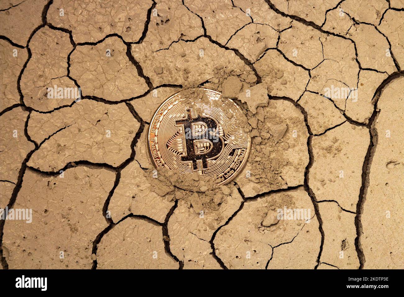 bitcoin lies on desert land, crypto currency crisis concept Stock Photo