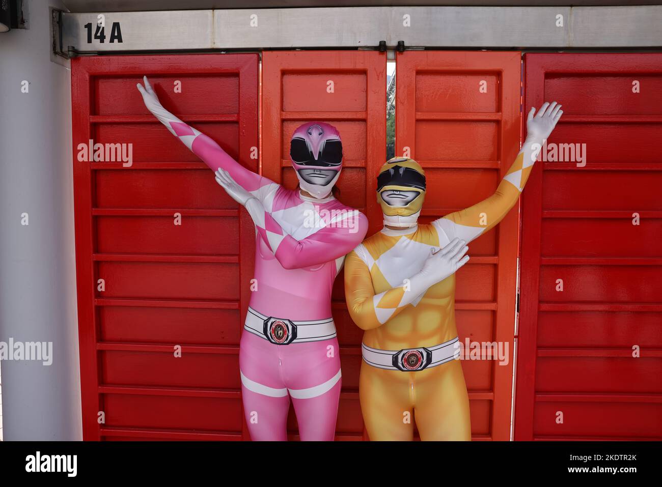 ***FOR USE ONLY*** Fans in costume pose for a photo, on