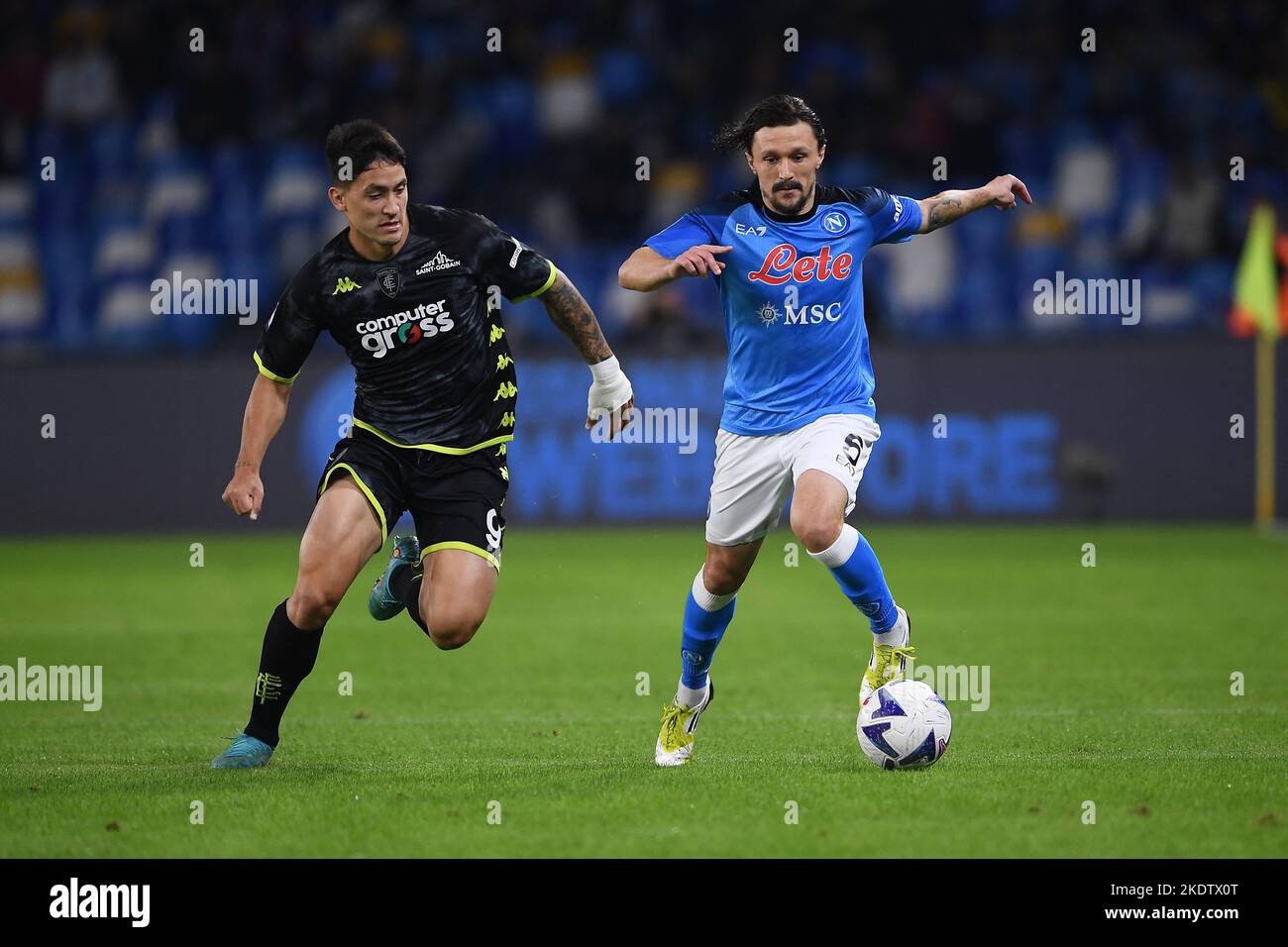 Naples, Italy. 08th Nov, 2022. Mario Rui of SSC Napoli and Martín Satriano of Empoli FC compete for the ball during the Serie A match between SSC Napoli and Empoli FC at Stadio Diego Armando Maradona, Naples, Italy on 8 November 2022. Credit: Nicola Ianuale/Alamy Live News Stock Photo