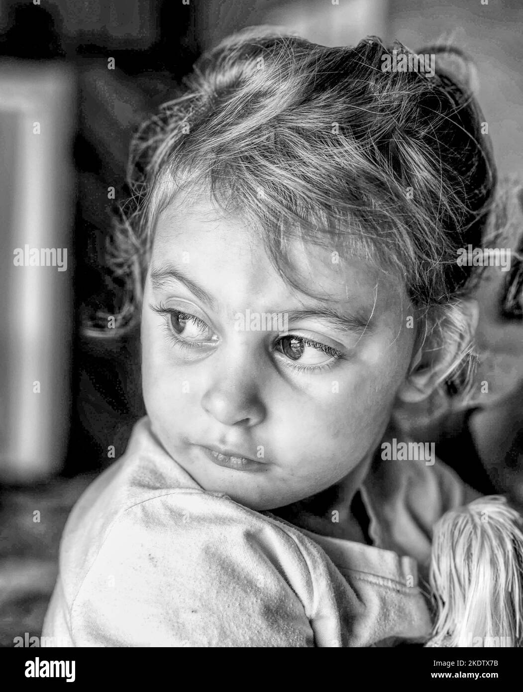 Portrait of a little girl staring at something (Black & White) Stock Photo