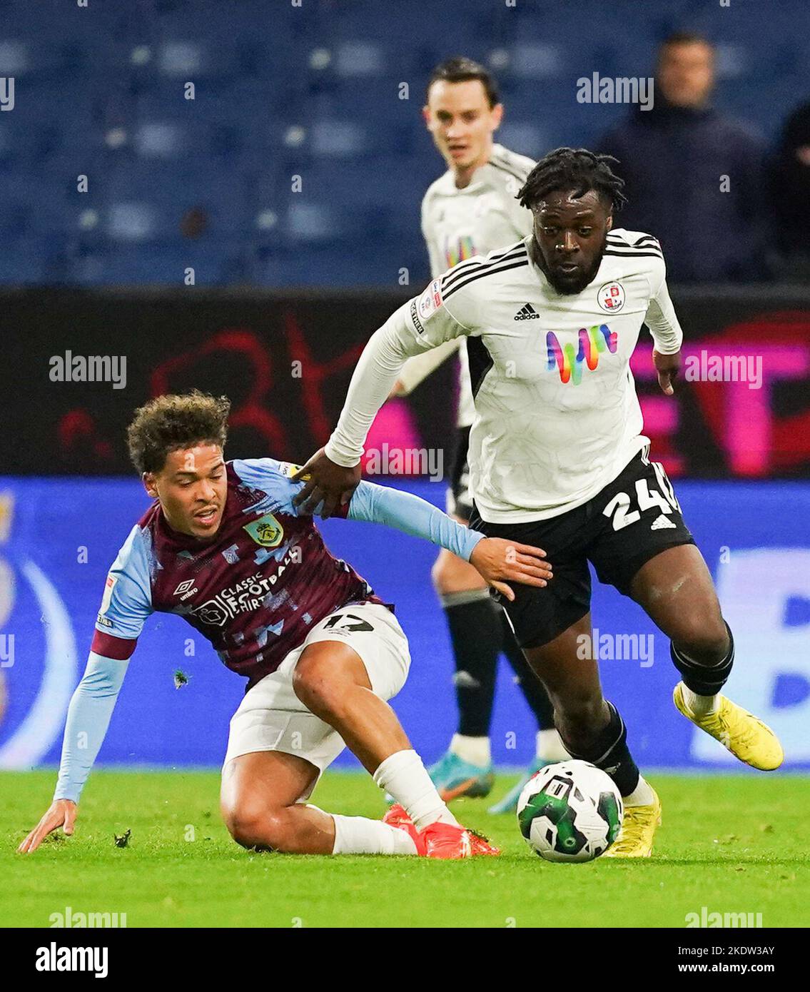 Burnley’s Manuel Benson (left) and Crawley Town's Aramide Oteh battle for the ball during the Carabao Cup third round match at Turf Moor, Burnley. Picture date: Tuesday November 8, 2022. Stock Photo