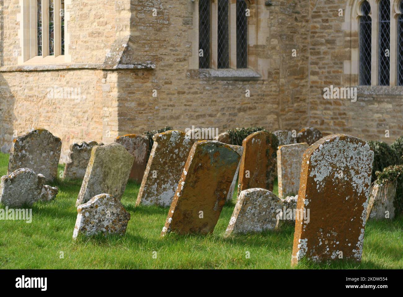 Very old headstones or tombstones in a churchyard Stock Photo - Alamy