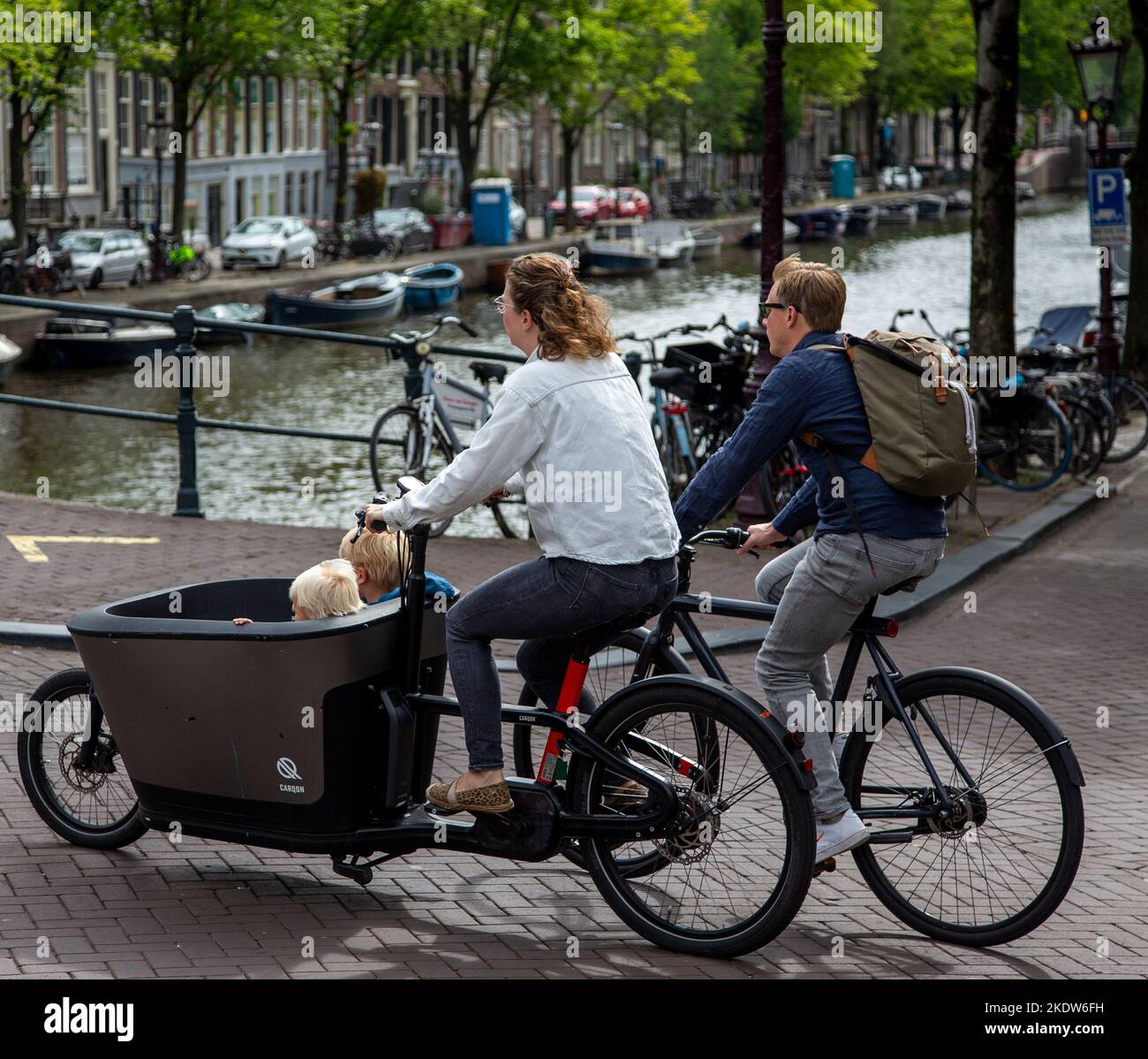 Family riding their bicycles in Amsterdam Stock Photo Alamy