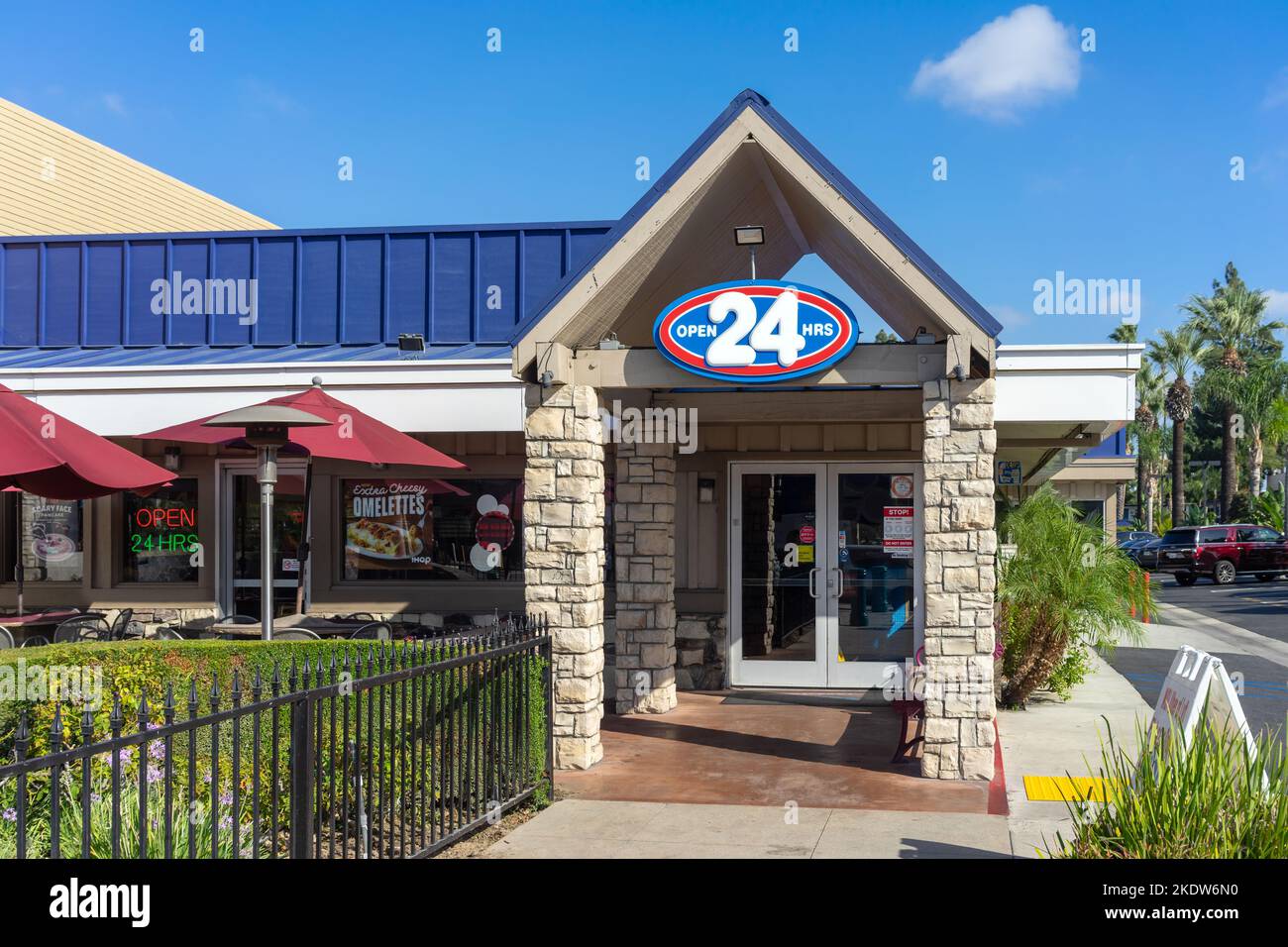 Anaheim, CA, USA – November 1, 2022: Open 24 Hours sign and front door for IHOP restaurant located on Harbor Blvd in the resort district in Anaheim, C Stock Photo