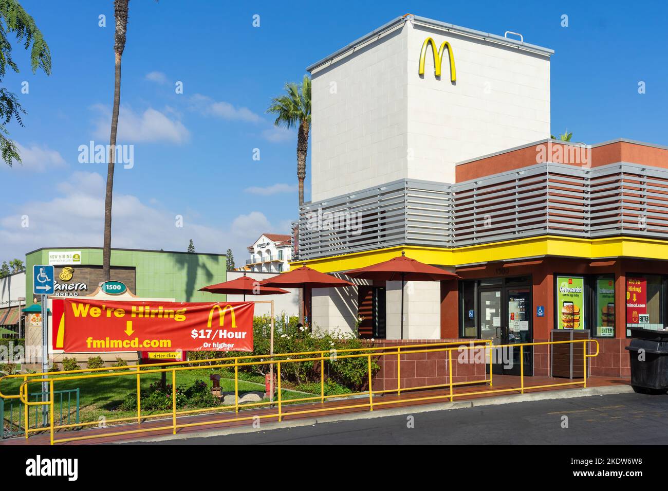 Anaheim, CA, USA – November 1, 2022: A We’re Hiring banner sign at a McDonald’s restaurant located on Harbor Blvd in Anaheim, California. Stock Photo