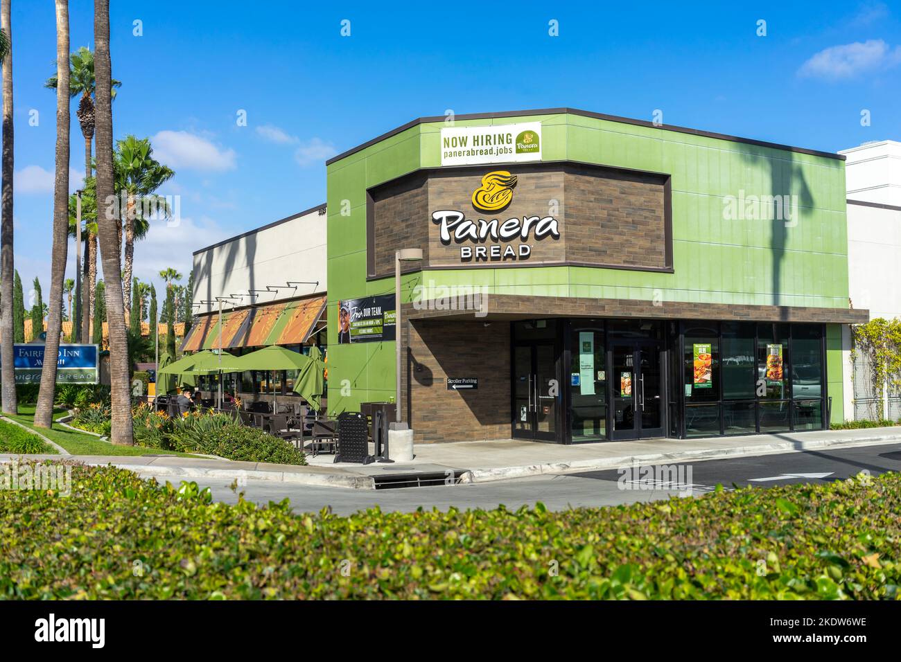 Anaheim, CA, USA – November 1, 2022: A Now Hiring banner sign at a Panera Bread restaurant located on Harbor Blvd in Anaheim, California. Stock Photo