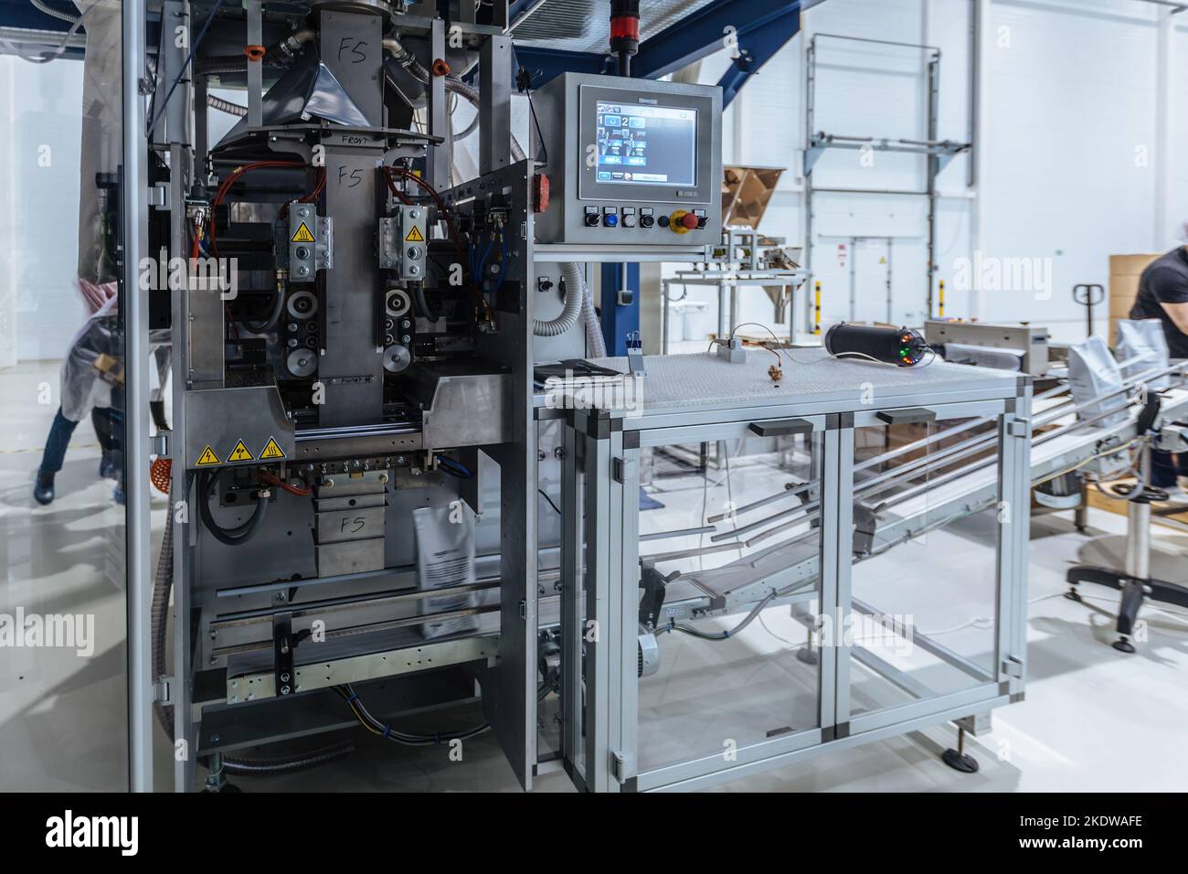 Modern industrial coffee packaging machine Stock Photo
