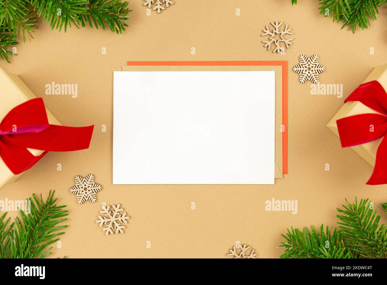 Christmas greeting card mockup and wrapped gift boxes with red ribbon