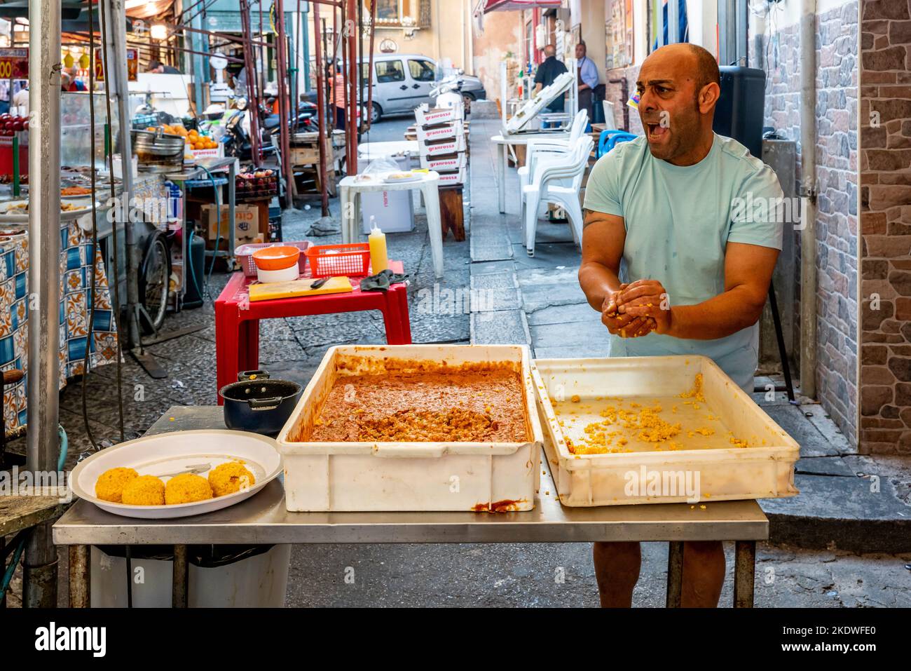 A Local Man Makes The Tradiitional Arancini (Rice Balls) At The Ballaro Street Market, Palermo, Sicily, Italy. Stock Photo