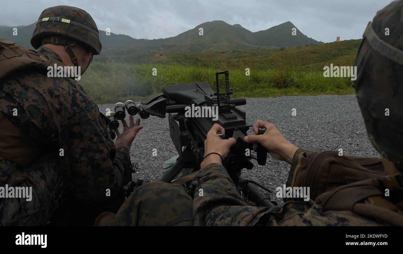 U.S. Marine Corps Lance Cpl. Emilio Lopez, machine gunner with 3d Battalion, 3d Marines fires a MK19 automatic grenade launcher in the Central Training Area on Okinawa, Japan Oct. 31, 2022. Marines took part in the live-fire range to maintain proficiency and readiness. 3/3 is forward-deployed in the Indo-Pacific under 4th Marines, 3d Marine Division as a part of the Unit Deployment Program.  Lopez is a native of Portag, Wisconsin. (U.S. Marine Corps photo by Lance Cpl. Eduardo Delatorre) Stock Photo
