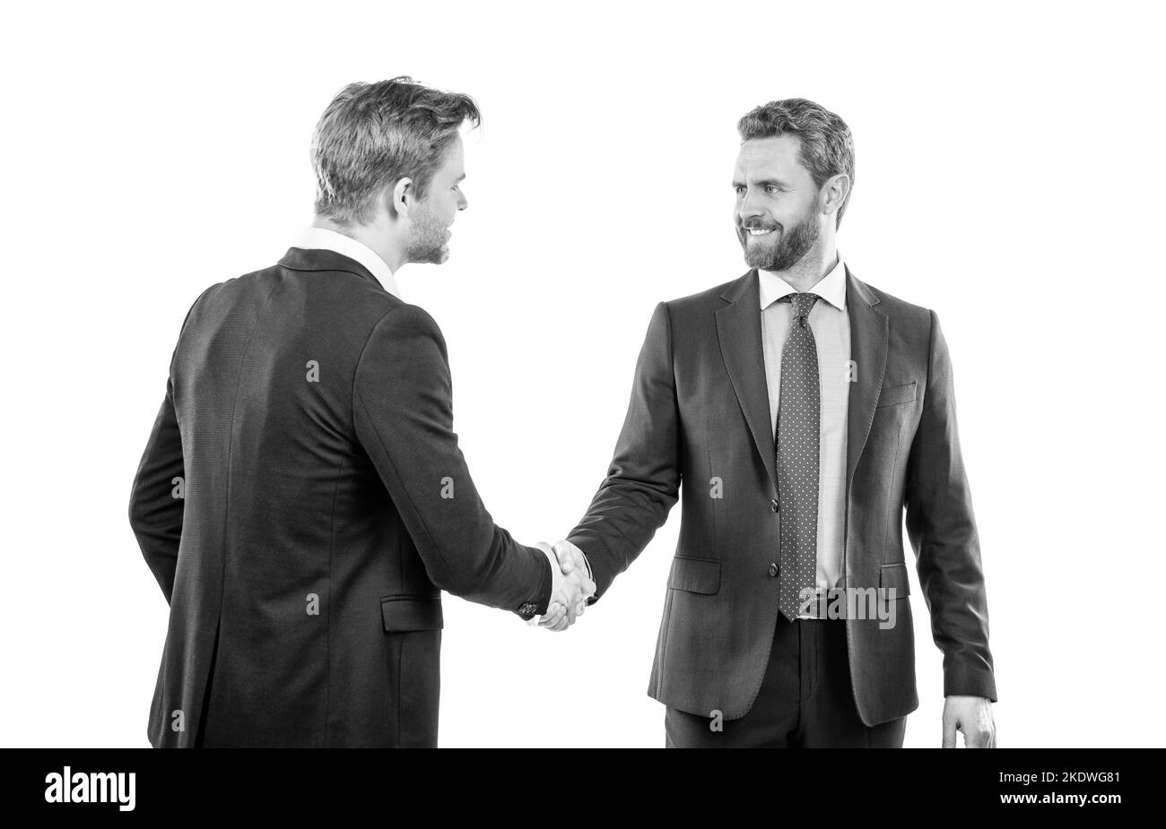 two businessmen colleagues shaking hands after successful business deal, welcome Stock Photo