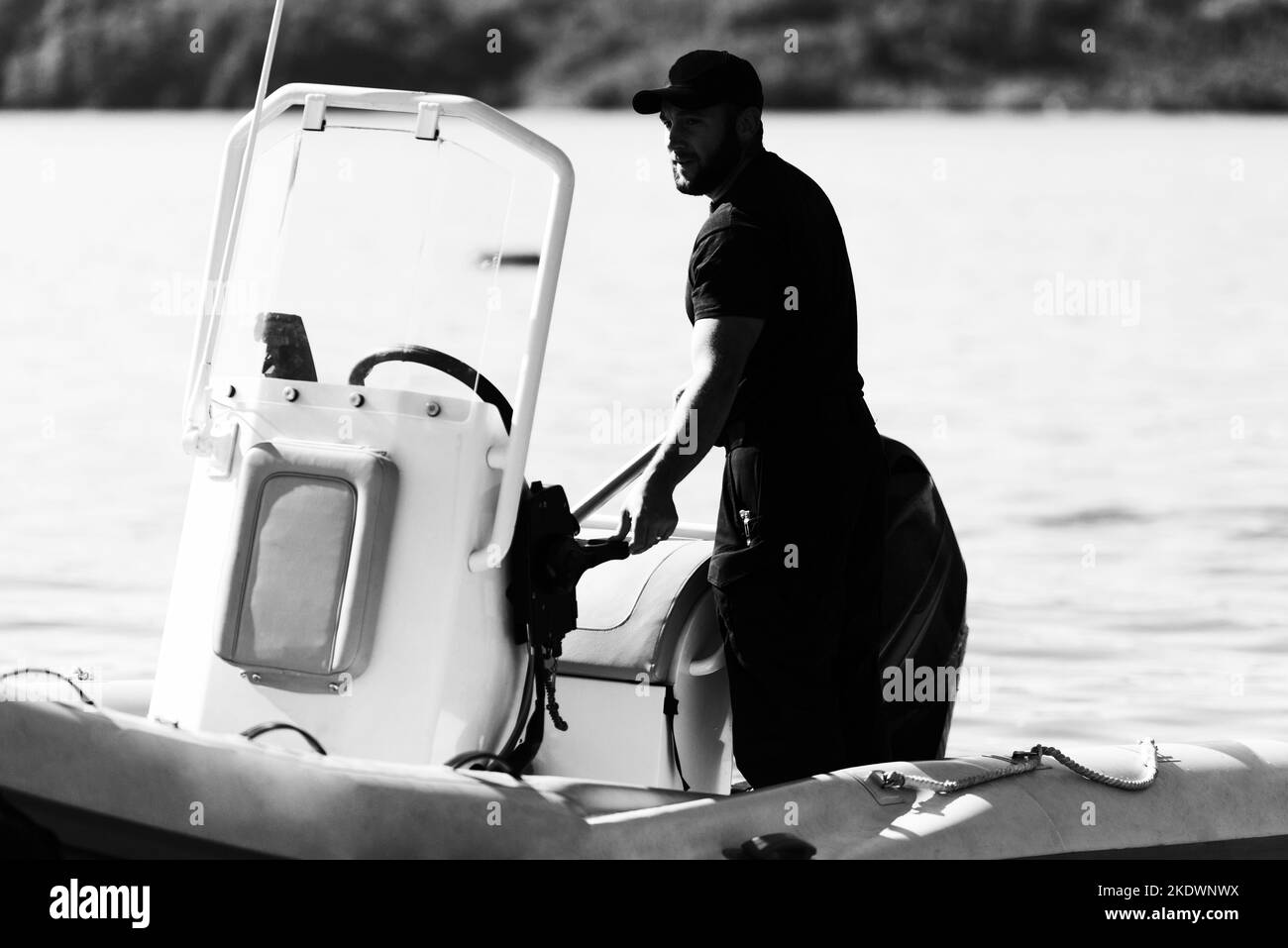 Rescuer in Protective Uniform on a Speedboat Observe the Ocean to