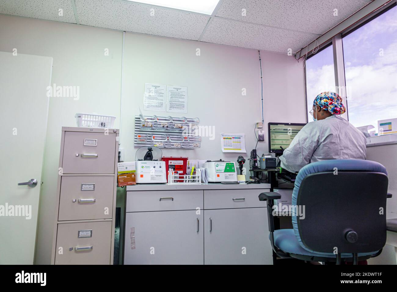 Miami Beach Florida,blood testing lab Black woman female technician employee employees worker workers working work workplace job jobs staff career car Stock Photo