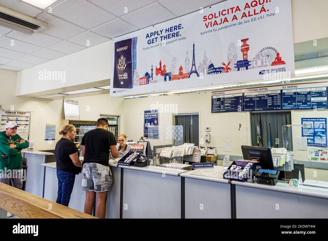 Miami Beach Florida,US post office counter,man men male woman women lady female adult adults,inside interior,employee employees worker workers working Stock Photo