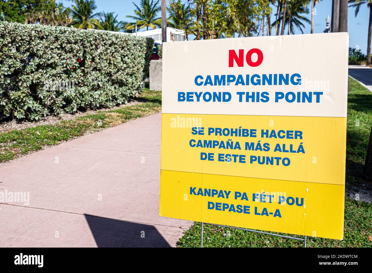 Miami Beach Florida,early voting three 3 languages multiple bilingual multilingual English Spanish Creole,sign no campaigning beyond this point, Stock Photo