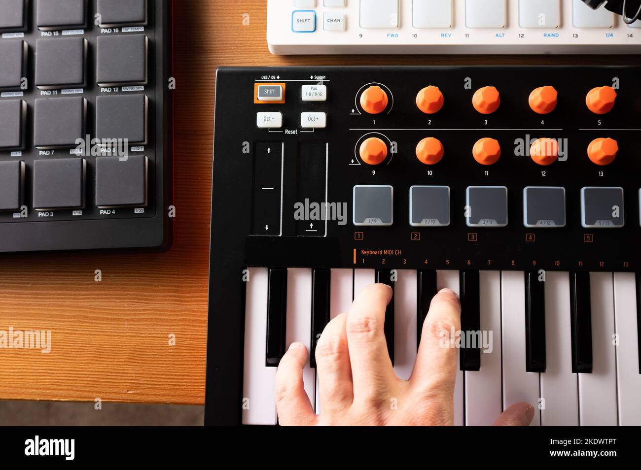 Musician's hands on midi keyboard. Musical equipment for recording