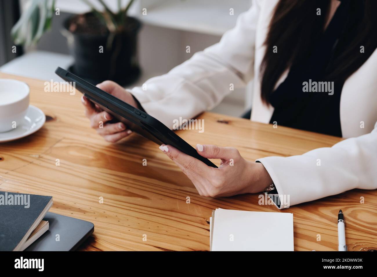 portrait-of-a-business-woman-using-a-tablet-computer-for-data-analysis