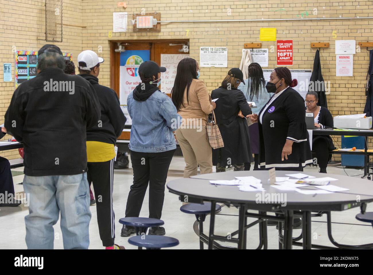 Detroit, Michigan, USA. 8th Nov, 2022. People wait in line to cast ballots in the 2022 midterm election at the J.E. Clark Preparatory Academy, a Detroit public school. Credit: Jim West/Alamy Live News Stock Photo