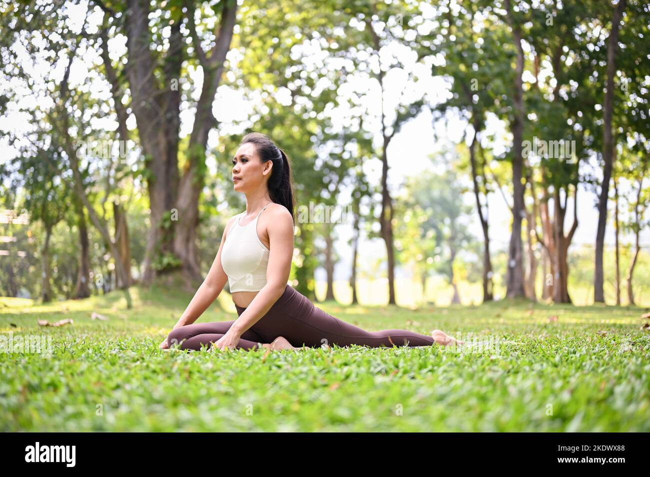 Gorgeous And Active Fit Asian Woman In Sportswear Practicing Half gorgeous-and-active-fit-asian-woman-in-sportswear-practicing-half