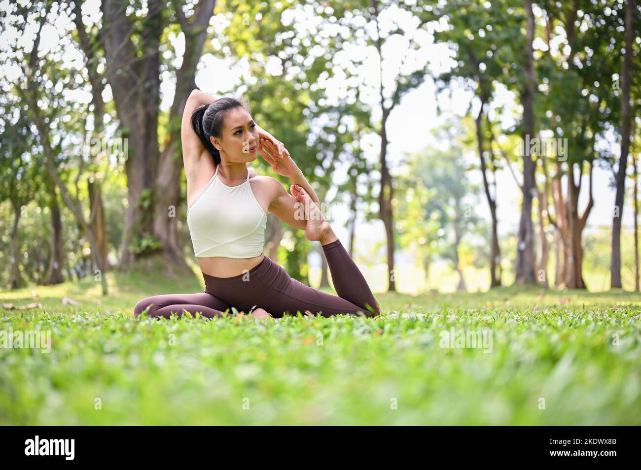 Young woman practicing yoga poses hi-res stock photography and images ...