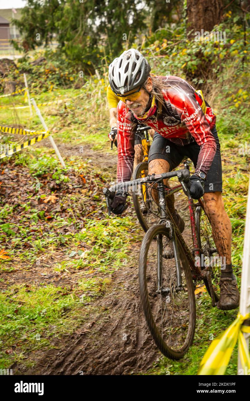 WA21418-00...WASHINGTON - Tom Kirkendall rounding a muddy corner that the Enumclaw 2021 CRX cyclocross race. Stock Photo