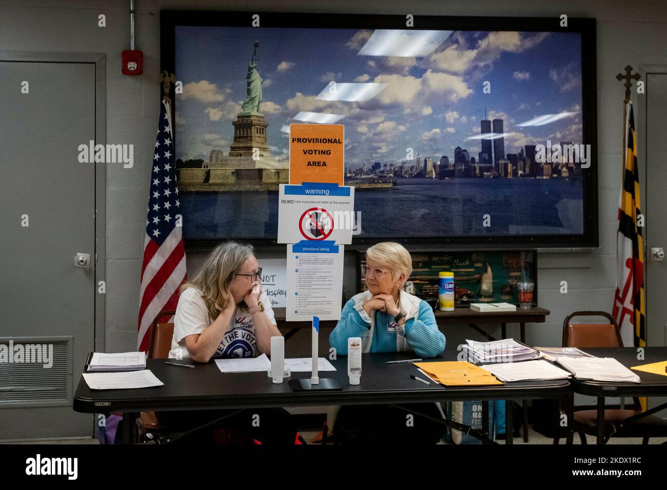 As Americans head to the polls to vote in the 2022 Midterm Elections, volunteer election officials Mary Sobray, left, and Sarah Mullikin, right, wait to assist voters at the Eastport Volunteer Fire Company in Annapolis, Maryland, Tuesday, November 8, 2022. Credit: Rod Lamkey/CNP Stock Photo