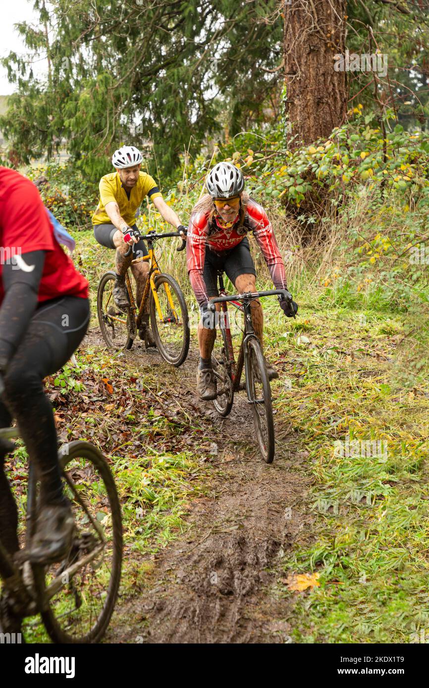 WA21421-00...WASHINGTON - Cyclocross race over rough, muddy ground at during the 2021 CXR cyclocross race at Enumclaw, WA. Stock Photo