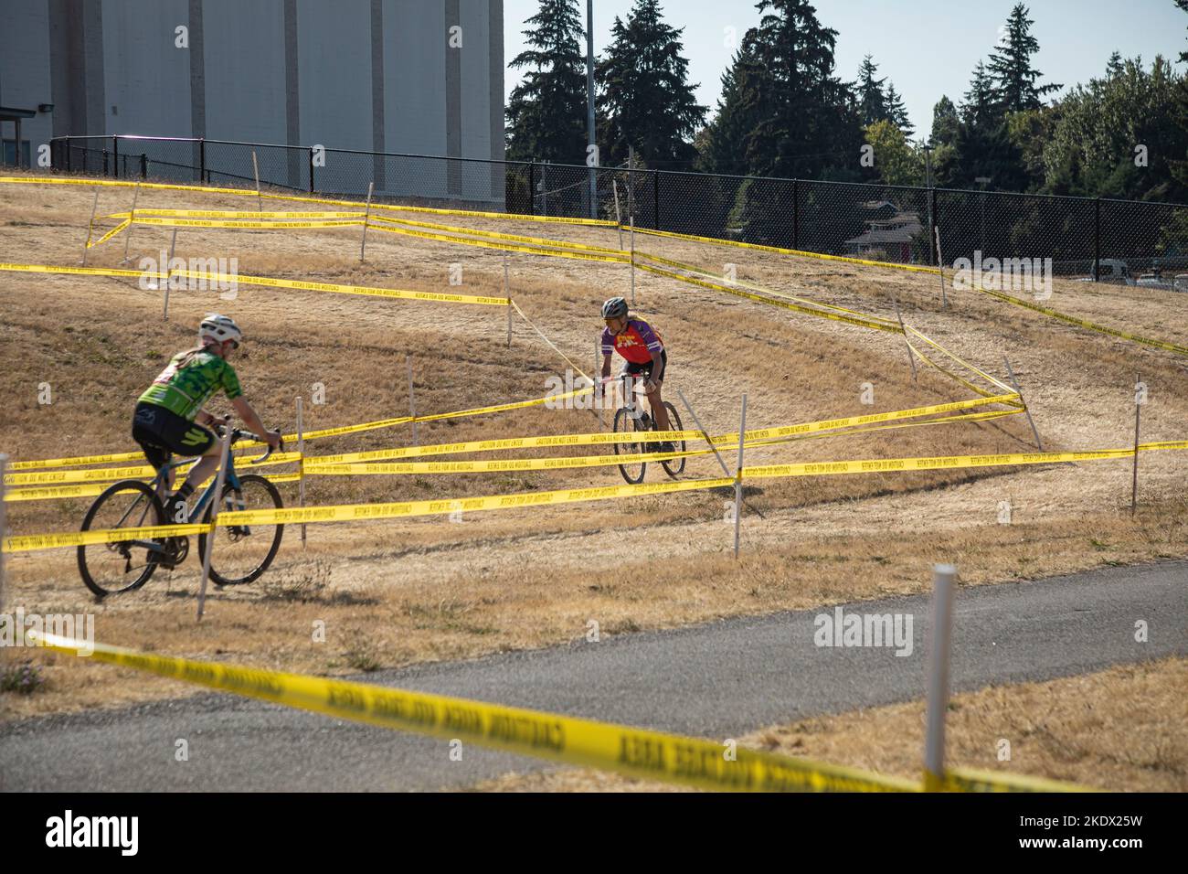 WA22610-00...WASHINGTON - Tom Kirkendall coming out of a series of curves while another rider enters in a cyclocross race  at Evergreen High School. Stock Photo