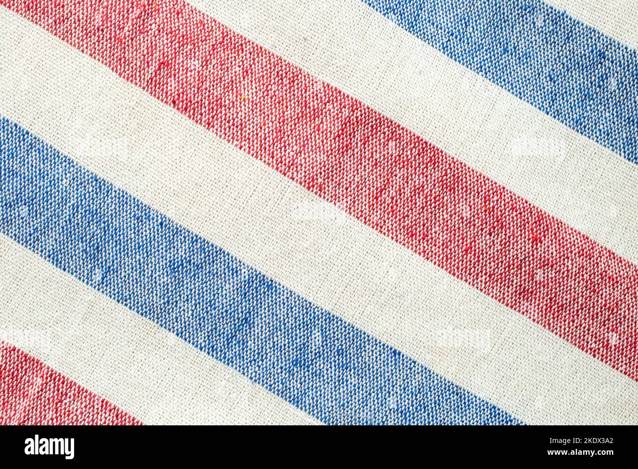 diagonal red, white and blue stripes of a thick fabric canvas, soft focus close up Stock Photo