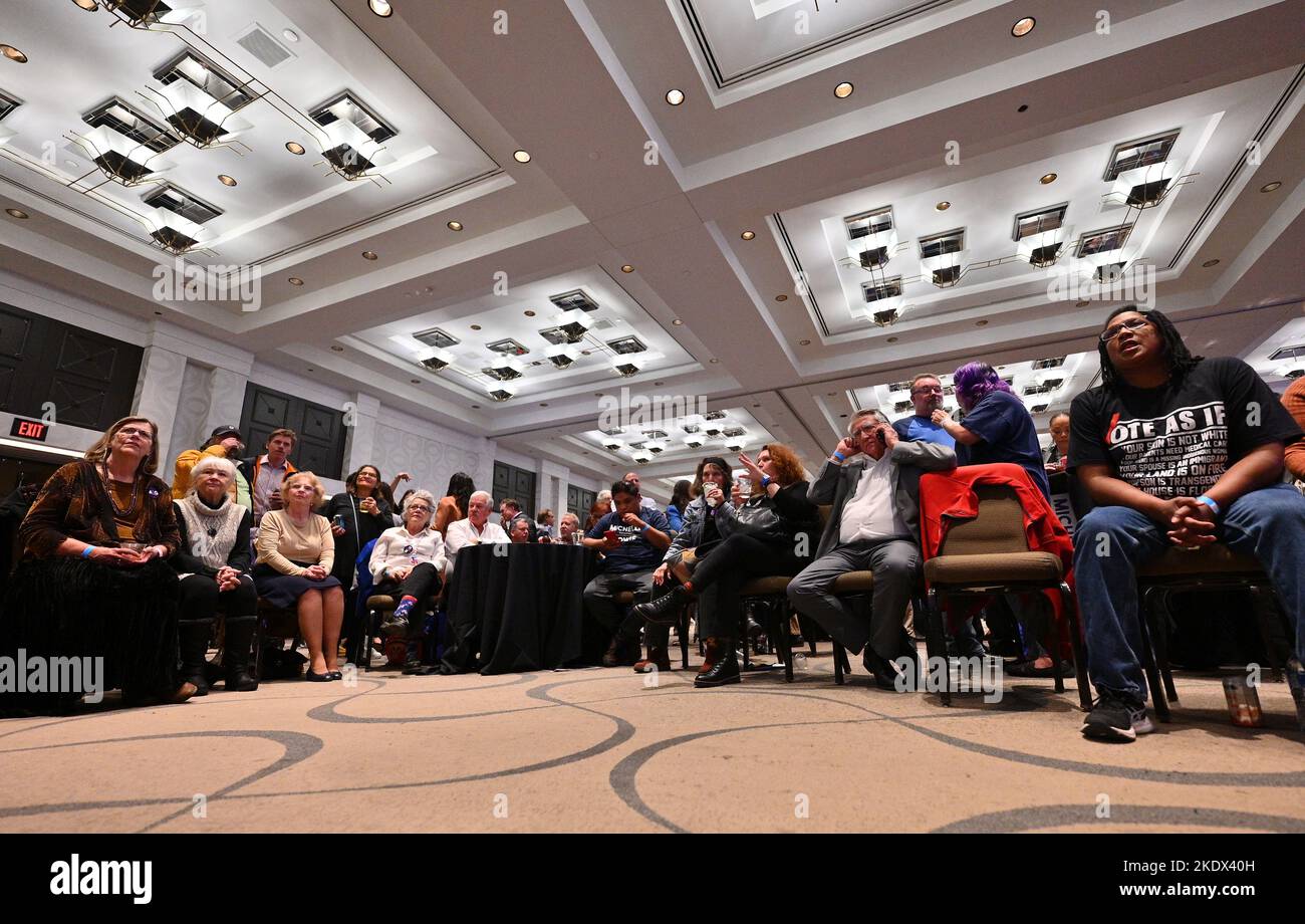 Attendees look on as election results are shown on a television at the New  Mexico Democrats watch party at the Clyde Hotel on November 8, 2022 in  Albuquerque, New Mexico. New Mexico