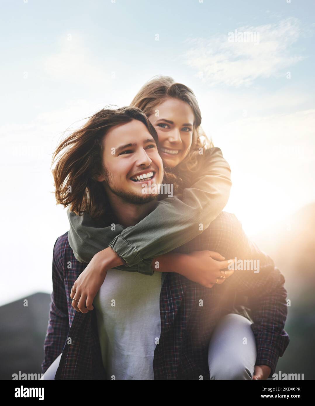 Sunshine days. Portrait of a happy young couple having fun outside. Stock Photo