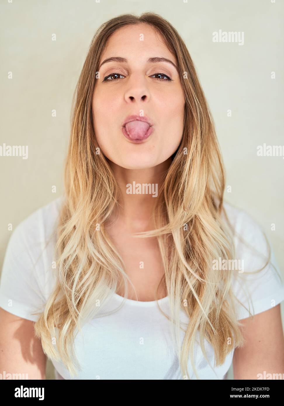 show her tongue out Beautiful caucasian woman sticking out hi-res stock photography and images  - Page 2 - Alamy