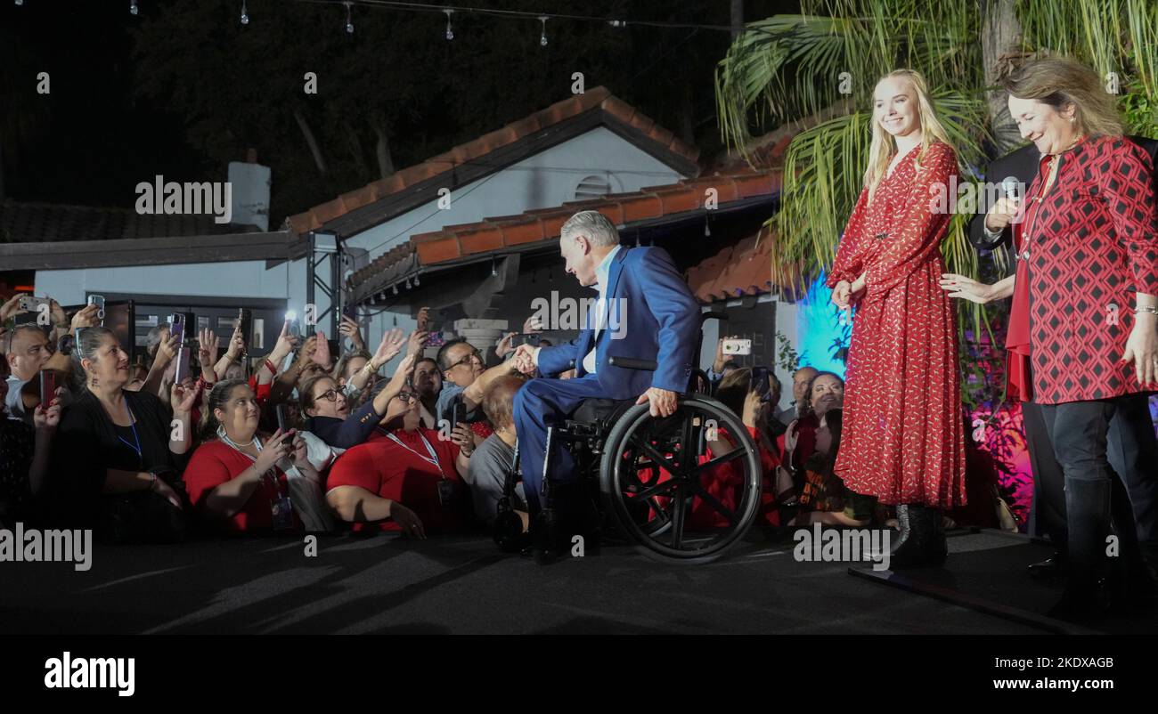 McAllen Texas USA, November 8 2022: Texas Governor GREG ABBOTT, joined onstage by his wife, Cecelia, and daughter, Audrey, revels in a re-election victory over Democratic challenger Beto O'Rourke during an election-night watch party. ©Bob Daemmrich Stock Photo