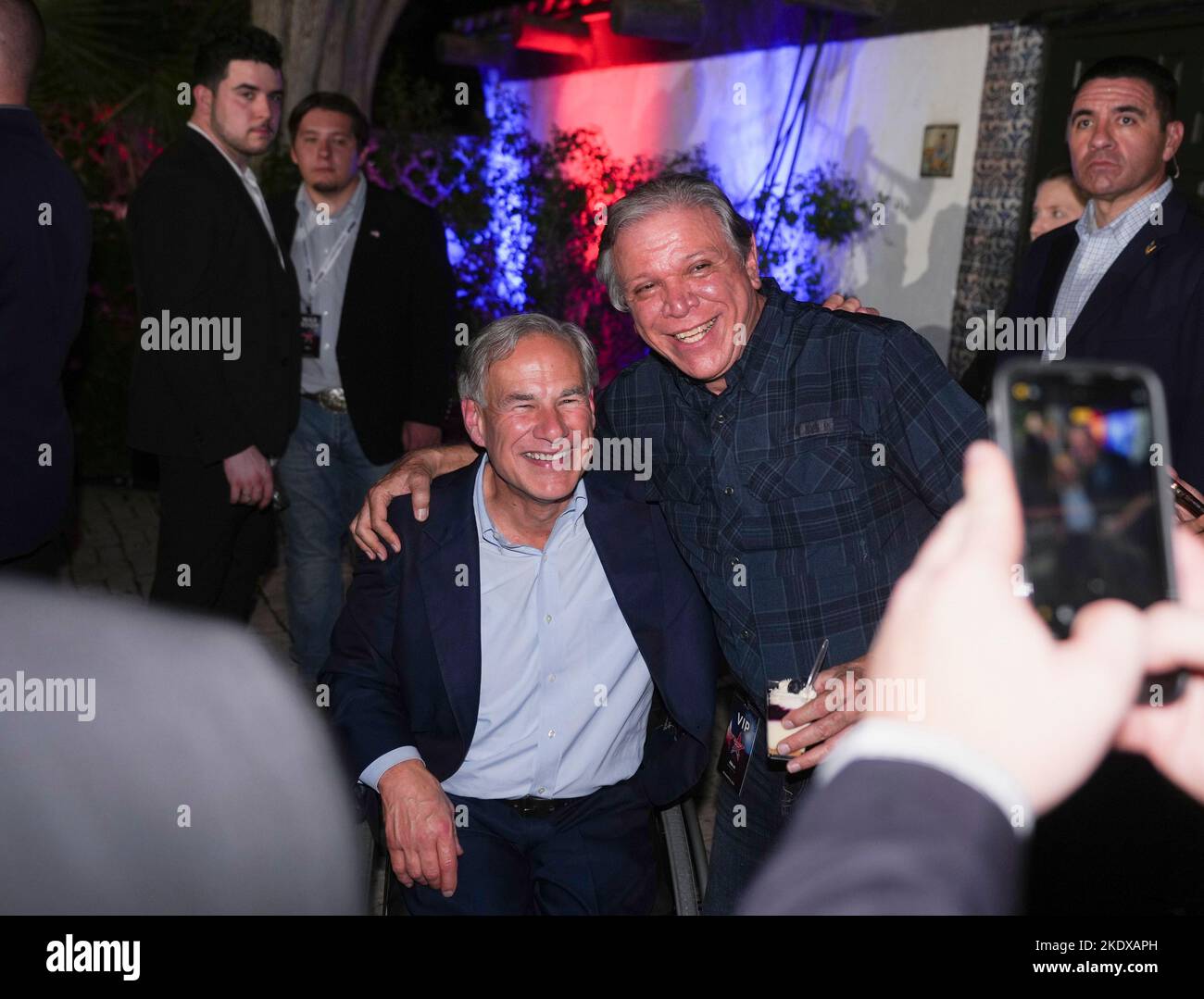 McAllen Texas USA, November 8 2022: Texas Governor GREG ABBOTT revels in a re-election victory over Democratic challenger Beto O'Rourke during an election-night watch party. At right is ARTURO FLORES of Edinburg, Texas Credit: Bob Daemmrich/Alamy Live News Stock Photo