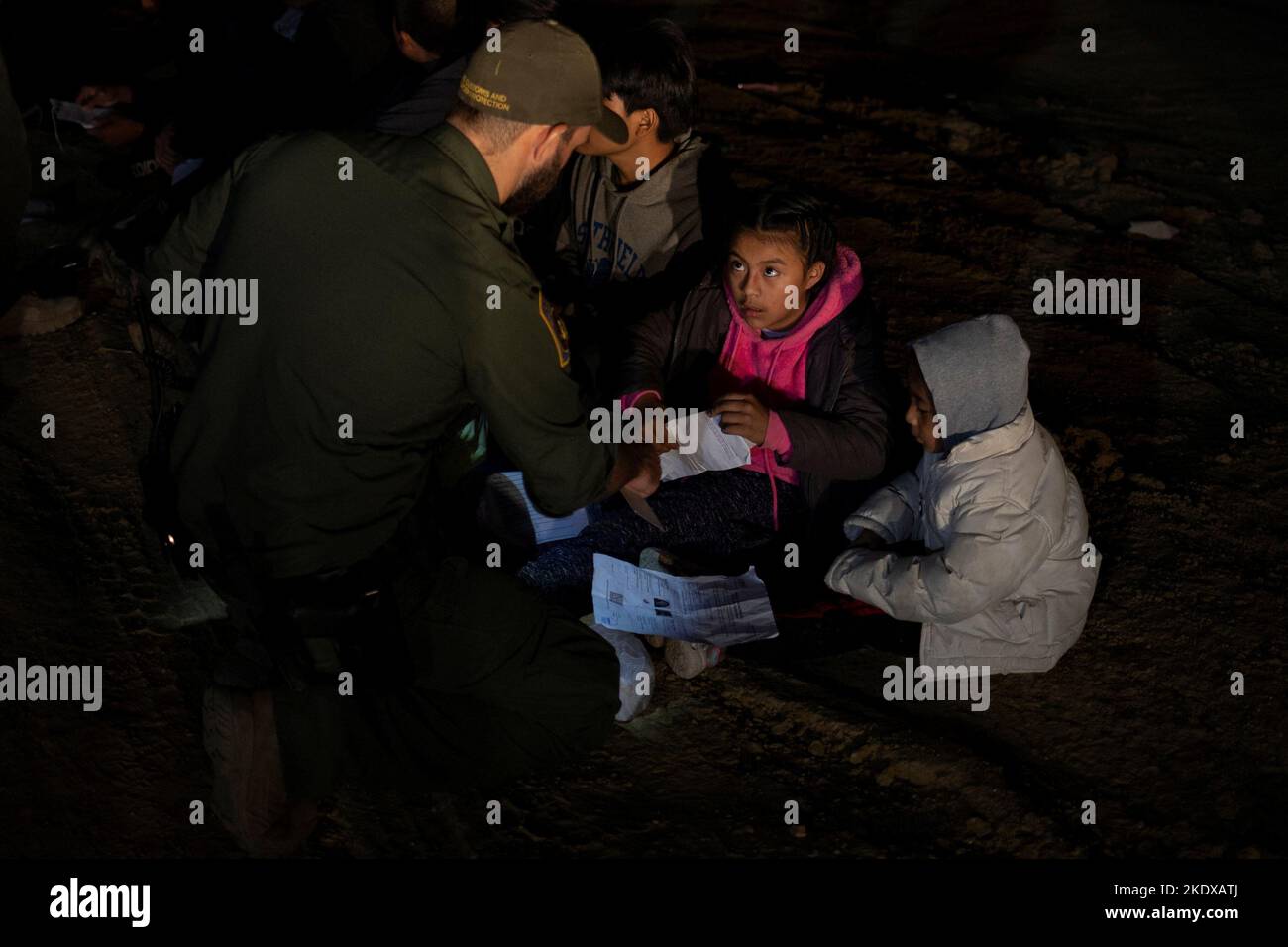 Youth migrants from Guatemala traveling without adults are questioned by Border Patrol agents after being smuggled across the Rio Grande river from Mexico into Roma, Texas, U.S., November 8, 2022.  REUTERS/Adrees Latif Stock Photo